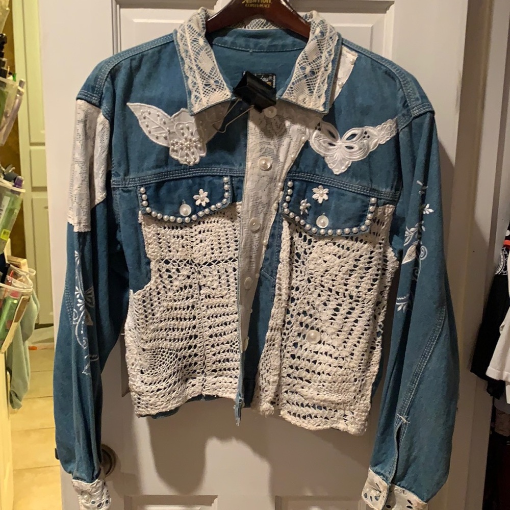Denim jacket with lace appliqués